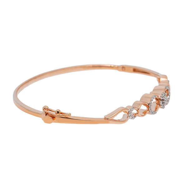 18K Rose Gold & 0.26ct Diamond Bangle (10.9gm) | 
Step into a world of elegance with our 18k rose gold and diamond Indian gold bangle from Virani ...