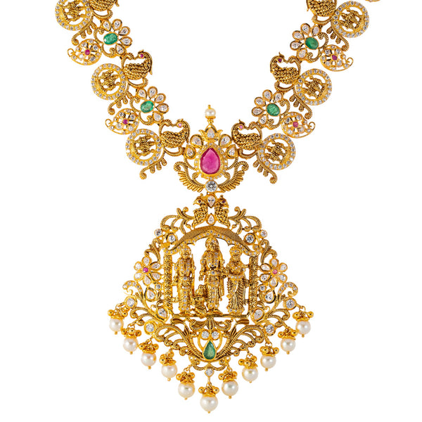 22k Yellow Gold Temple Necklace Set  w/ Gemstones & Pearls (130.6gm) | 


Virani Jewelers invites you to indulge in symphony of cultural elegance with this 22k gold nec...