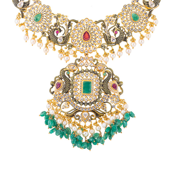 22K Antique Gold, CZ, Ruby, Pearl & Emerald Peacock Jewelry Set (158.5gm) | 


Indulge in the epitome of luxury with this stunning 22k antique gold and gemstone jewelry set ...