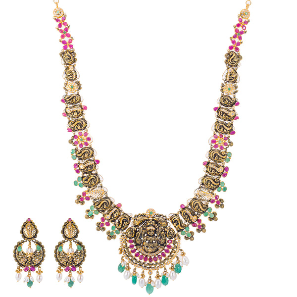 22K Antique Gold, CZ, Ruby, Pearl & Emerald Temple Jewelry Set (84.1 grams) | 


Indulge in opulent allure with this 22k antique gold and gemstone temple jewelry set by Virani...