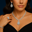 A woman wearing 18k gold and diamond jewelry set by Virani Jewelers