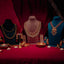 Jewelry display with necklaces, earrings, and other accessories on a red background.