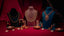 22K gold jewelry by Virani Jewelers set on mannequins with candles on a red fabric background
