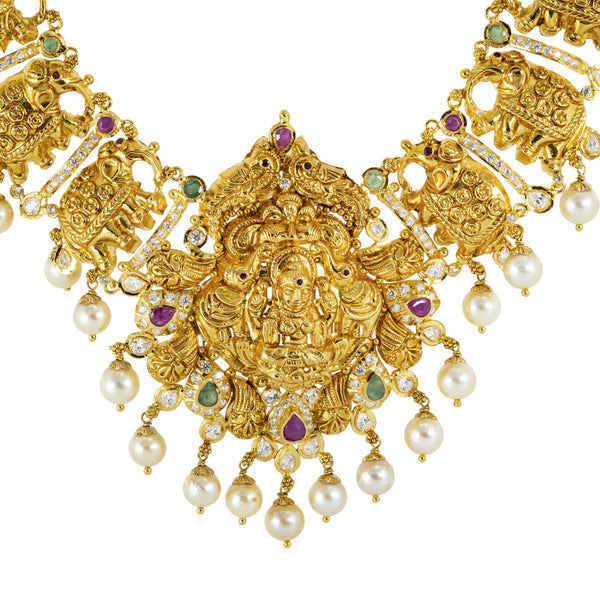 22K Yellow Gold, Emerald, Ruby, Pearl, and CZ Temple Necklace (104.1gm) | 



Elevate your bridal ensemble with this radiant 22k gold temple necklace and earrings set by V...