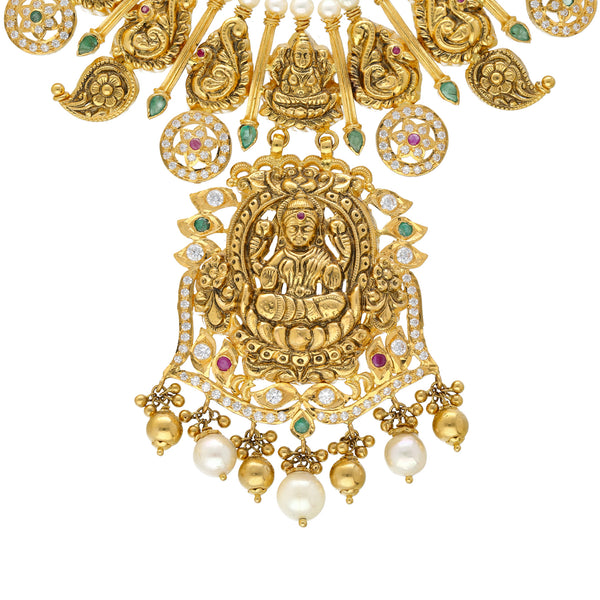 22K Yellow Gold, Gemstone & Pearl Laxmi Necklace (100.4gm) | 


Indulge in the allure of this 22k gold temple necklace by Virani Jewelers—a masterpiece that r...