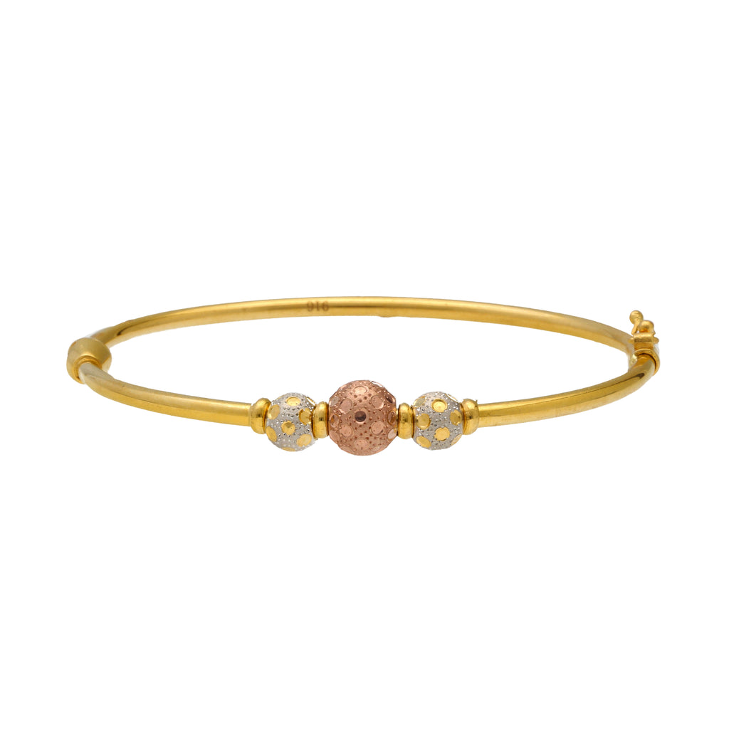 22K Multi-Tone Gold Ball Bead Bangle (10.5gm) | 


Experience elegant opulence with this 22k gold beaded bangle by Virani Jewelers.   Each decora...