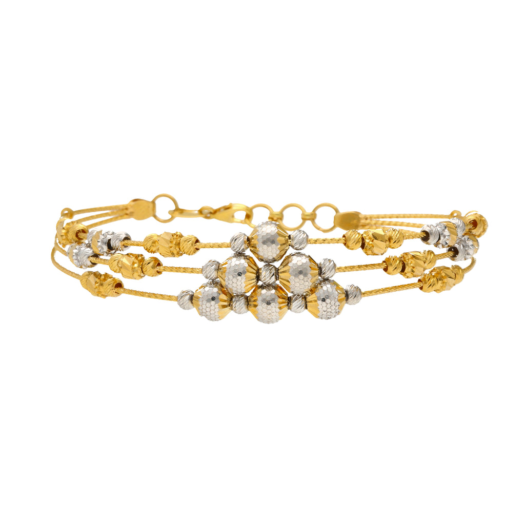 22K Multi-Tone Gold Triple Layer Beaded Bangle (13.3gm) | 


Revel in magnificent details of this 22k gold beaded bangle by Virani Jewelers.   Each delicat...