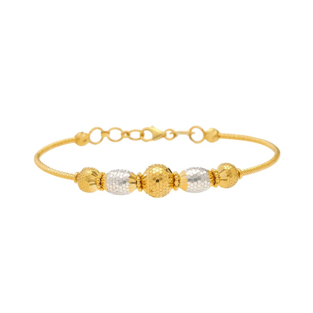 22K Yellow & White Gold Beaded Bangle (10.9gm) | 


Virani Jewelers invites you to indulge in the timeless beauty of this 22k gold beaded bangle. ...
