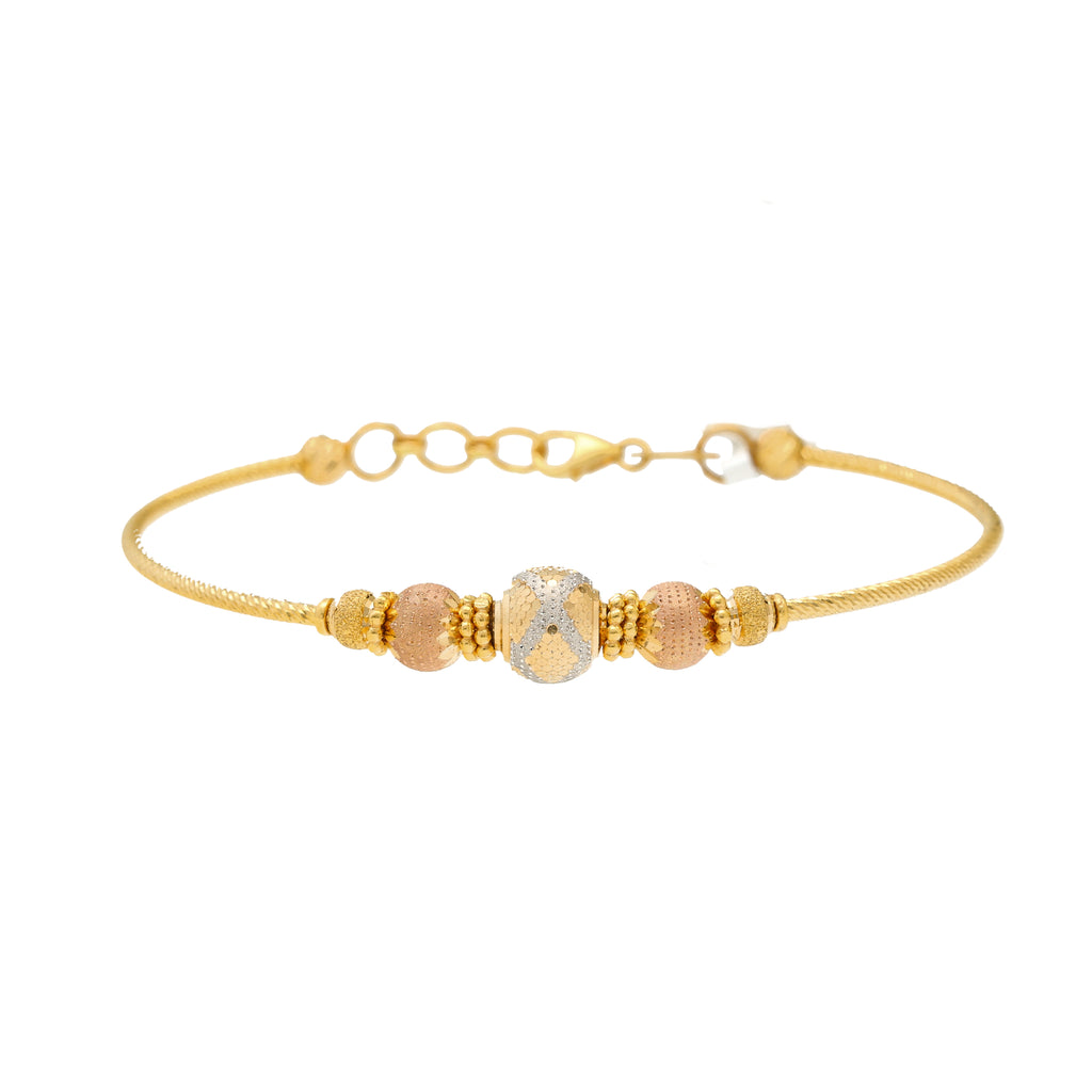 22K Multi-Tone Gold Beaded Bangle (9.6gm) | 


Unveil the golden elegance of this 22k multi-tone gold beaded bangle by Virani Jewelers.   Eac...