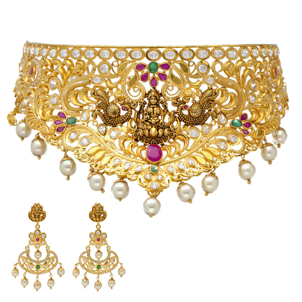 22K Yellow Gold Lakshmi Choker Set w/ Gems & Pearls (95.5gm) | 


Virani Jewelers presents a vibrant masterpiece in the form of this 22k gold choker and earring...