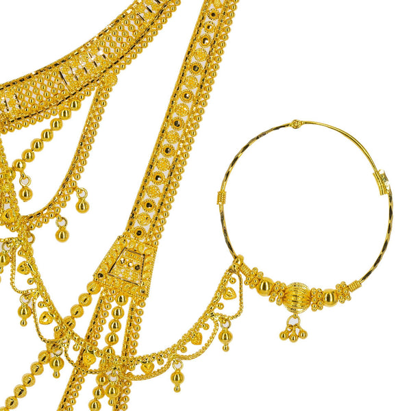 An image of the detail on the 22K gold nose ring from Vriani Jewelers. | Look like the most stunning person in the room with this magnificent 22K gold necklace set from V...