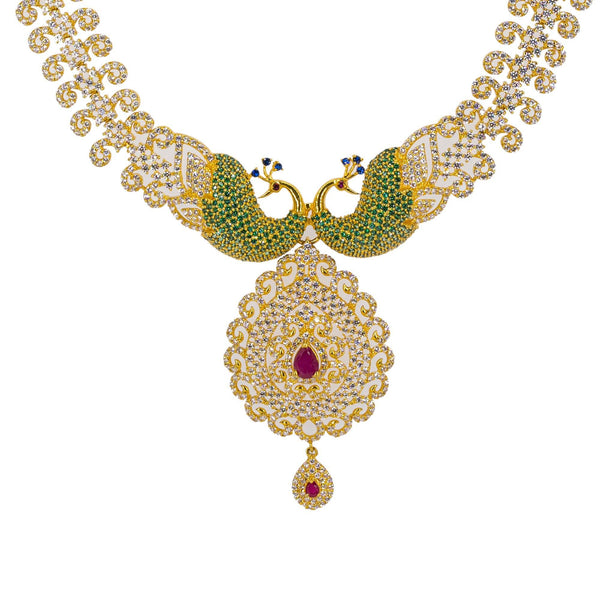 A close-up image of the 22K gold pendant and peacock accents on the necklace from Virani Jewelers. | Make your evening one to remember with this gorgeous 22K gold necklace from Virani Jewelers!

Fea...