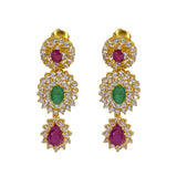 A close-up image of the ruby and emerald Indian gold earrings from Virani Jewelers. | Radiate sophistication with this 22K yellow gold necklace from Virani Jewelers!

Made with precio...