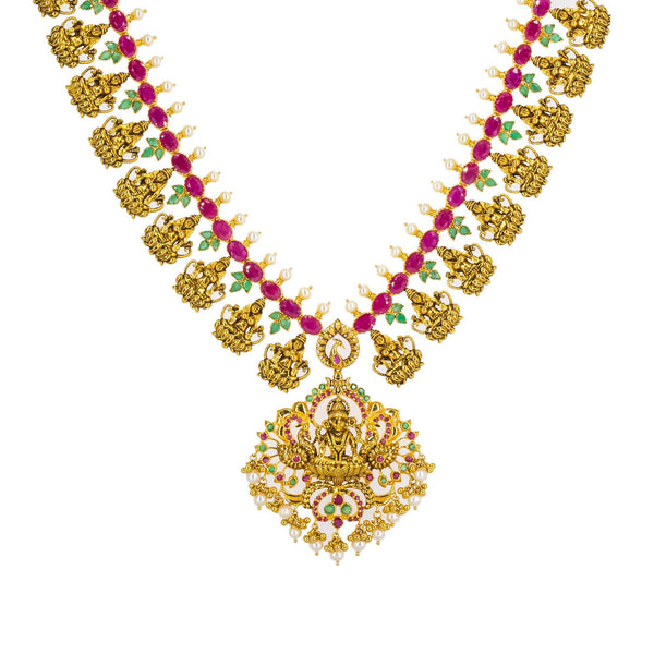 An image of an intricate Laxmi necklace crafted out of 22K gold by Virani Jewelers | Accessorize with ornate 22K yellow antique gold jewelry from Virani Jewelers! 

Elegant necklace ...