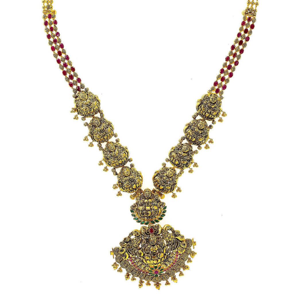 An image of an ornate, temple-style Indian necklace from Virani Jewelers | Add the elegance and beauty of South Asian culture to your attire with this exquisite 22K yellow ...