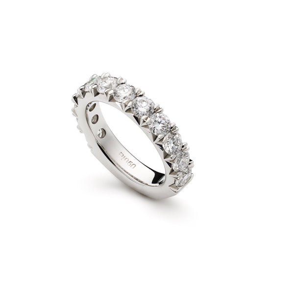 An image showing the side of a 14K white gold wedding ring from Virani Jewelers. | Express your love with a beautiful 14K white gold channel-set diamond wedding band from Virani Je...