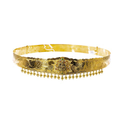 A picture featuring a 22K waist belt from Virani Jewelers that has a raised image of Laxmi along with laser-etched peacock details and hanging gold balls.