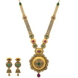 An image of the Vasudha 22K gold necklace set with emeralds and rubies from Virani Jewelers. | Give your confidence a boost with this 22K gold necklace set from Virani Jewelers!

Features meda...