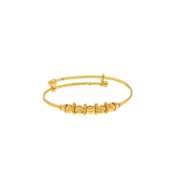 An image of a single Sunny 22K gold baby bangle from Virani Jewelers. | Get the entire family dressed up with the Sunny 22K gold baby bangles from Virani Jewelers!

Made...