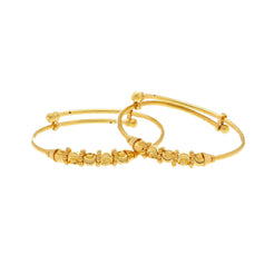 An image of a pair of Sunny 22K gold baby bangles from Virani Jewelers.