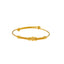An image of a single 22K gold bangle with a textured design from Virani Jewelers.