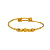 An image of a single 22K gold bangle with gold beads from Virani Jewelers. | Treat your little one to fine jewelry with this set of 22K gold bangles from Virani Jewelers!

Ma...