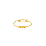 An image of the 22K gold bangle with an adjustable band and three gold beads and two spacers from Virani Jewelers. | Introduce your child to a world of elegance with this 22K gold baby bangle from Virani Jewelers!
...