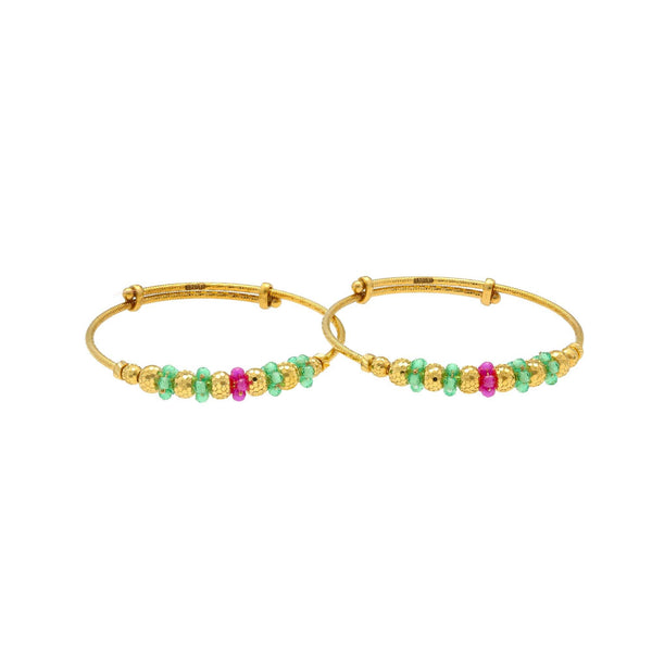 An image of two 22K gold bangles with an adjustable band and emerald and ruby bead embellishments from Virani Jewelers. | Add color to your child’s wardrobe with these beautiful 22K gold bangles from Virani Jewelers!

D...