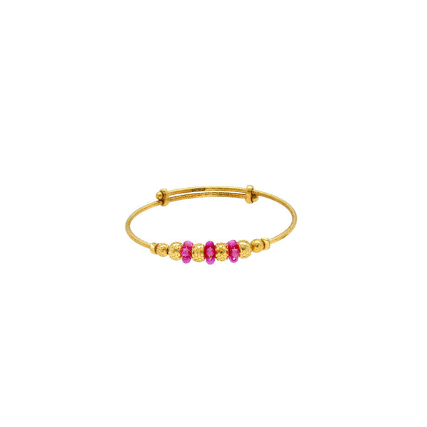 An image of a single 22K gold bangle with gold and ruby beads from Virani Jewelers. | Help your little one celebrate their culture with these 22K gold bangles from Virani Jewelers!

D...
