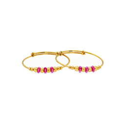 An image of the Virani 22K gold bangles with gold and ruby beads and an adjustable band.
