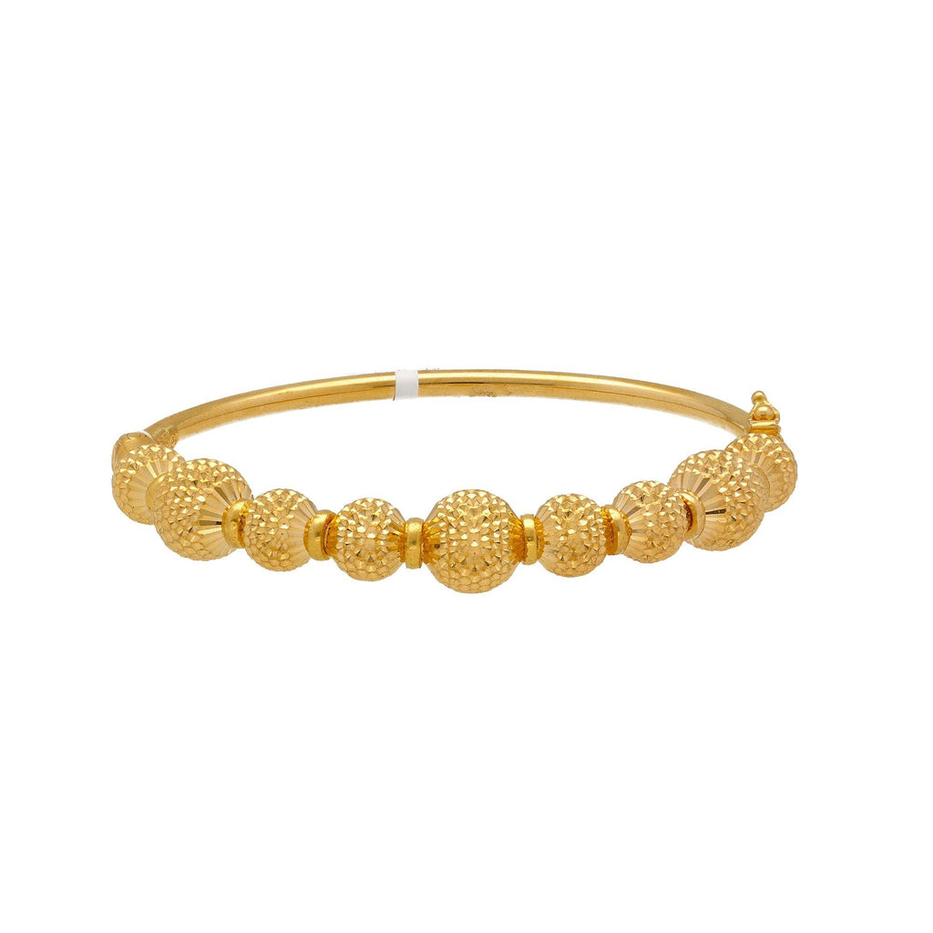 22K Yellow Gold Bangle W/ Gold Ball Accented Band - Virani Jewelers | 


Accessorize your most casual attire with the brilliance of this 22K yellow gold bangle, beauti...