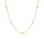 An image of a white and yellow 22K gold necklace with bead accents from Virani Jewelers.