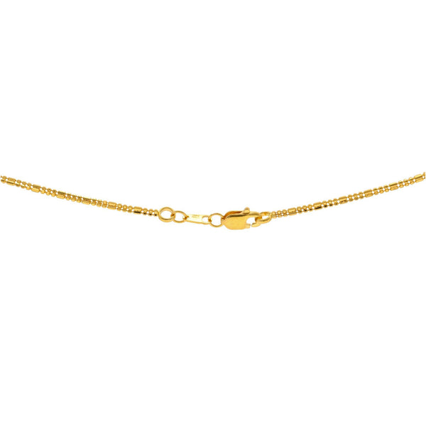A close-up image showing the 22K gold lobster clasp on the multi-tone necklace from Virani Jewelers. | Complement every outfit in your wardrobe with this gorgeous 22K gold chain from Virani Jewelers!
...