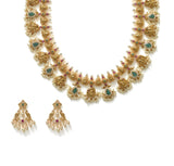 22K Yellow Gold Guttapusalu Necklace & Earrings Set W/ Pearls, Rubies, Emeralds, CZ Polki & Lord Ganesh Accents - Virani Jewelers | 
Find the beauty in blending tradition and luxury with this most exquisite 22K yellow gold Guttap...