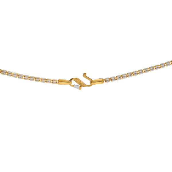 A close-up image of the S-closure for the Indian gold necklace from Virani Jewelers. | Take your style up a notch with the Multi Tone 22K gold necklace from Virani Jewelers!

Features ...