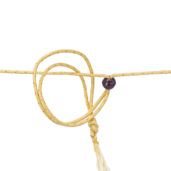 An image of a 22K gold rope with a purple bead holding it together from Virani Jewelers. | Stand out from the crowd with this gorgeous 22K gold necklace set from Virani Jewelers!

Features...