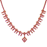 22K Yellow Gold & Ruby Necklace Set | 


This unique 22K Indian gold necklace and earring set is decked out with vibrant rubies that wi...