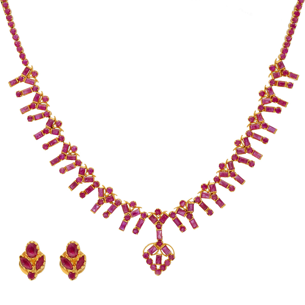 22K Yellow Gold & Ruby Necklace Set | 


This unique 22K Indian gold necklace and earring set is decked out with vibrant rubies that wi...