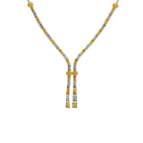An image of an elegant, 22K gold Indian necklace crafted by Virani Jewelers | This 22K yellow and white gold set from Virani Jewelers is an exquisite way to complement any for...
