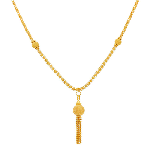 A close-up image showing the details on the 22K gold tassel necklace from Virani Jewelers. | Add some elegance to your daily attire with this beautiful 22K gold necklace set from Virani Jewe...