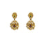 A close-up image of the 22K gold earrings with emeralds, rubies, and uncut diamonds from Virani Jewelers.