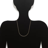An image of a dark silhouette wearing the 22K gold chain for women from Virani Jewelers. | Create a classic and timeless look when you buy a 22K gold chain from Virani Jewelers.

Perfect f...