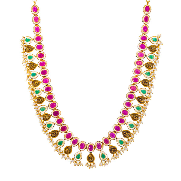 22K Yellow Gold, Gemstone, and Pearl Necklace (108.7gm) | 
Pair this 22k yellow gold, gemstone, and pearl necklace with your bridal or traditional gowns fo...