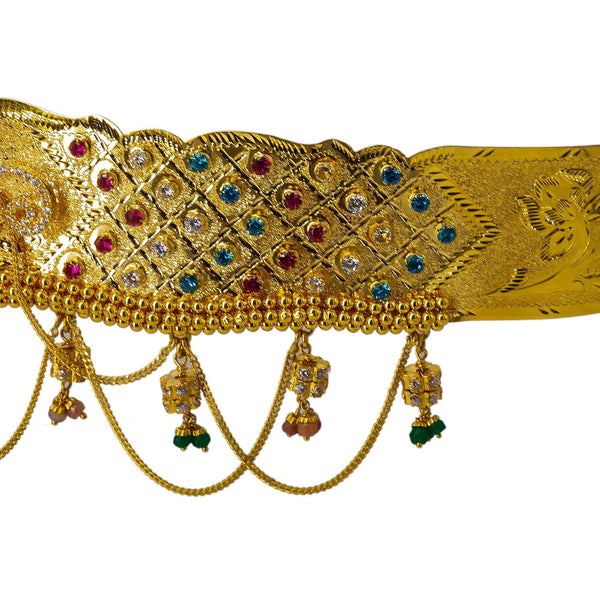 A close-up shot of the side of a 22K waist belt from Virani Jewelers featuring beautiful gemstones and ornate chandelier accents. | Add movement and luxury to your most festive looks with Vaddanam waist belts that will transform ...