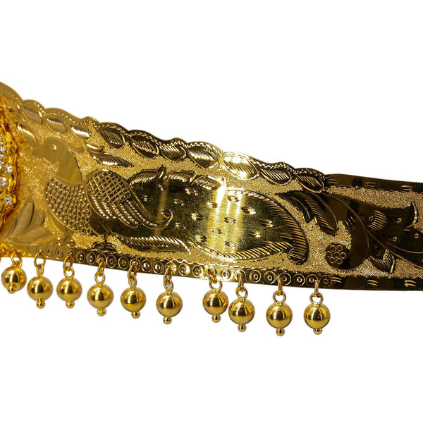 A close-up shot of the peacock and dangling gold balls that are featured on a 22K waist belt from Virani Jewelers. | Add movement and luxury to your most festive looks with Vaddanam waist belts that will transform ...