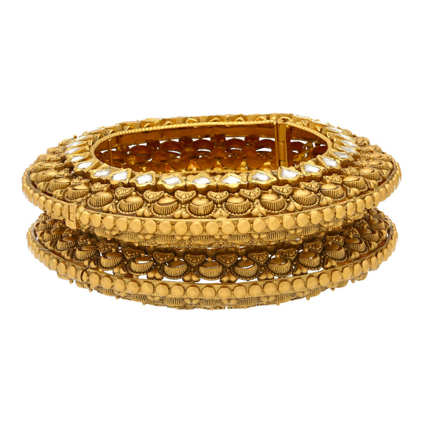 22K Yellow Gold Charita Bangle Set (125.1gm) | 
This unique pair of 22k yellow gold bangles have traditional kundan stones incorporated into the...