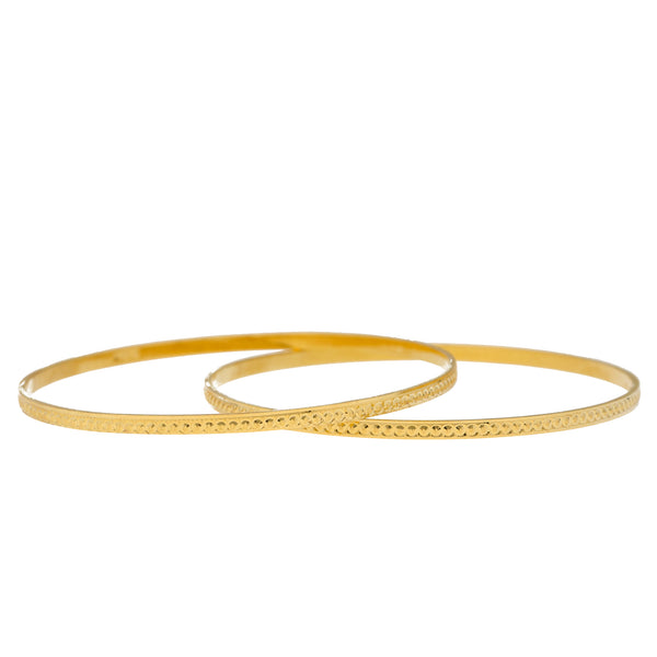 22K Yellow Gold Bangle Set of 12 (129.7gm) | 
This stunning set of 22k gold Indian bangles have an intricate design made of engraved details. ...