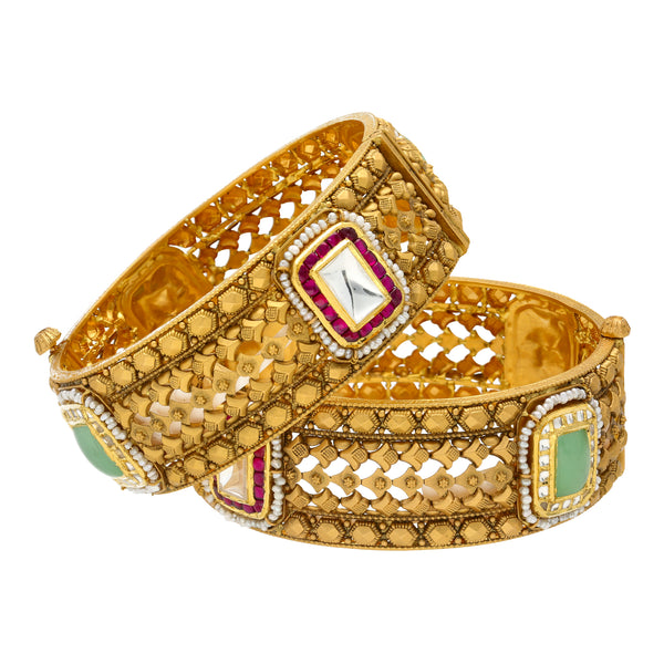 22K Yellow Gold Rajeshri Bangle Set (72.5gm) | 
The 22K Yellow Gold Rajeshri Bangle Set has a unique cultural design decorated with a luxurious ...