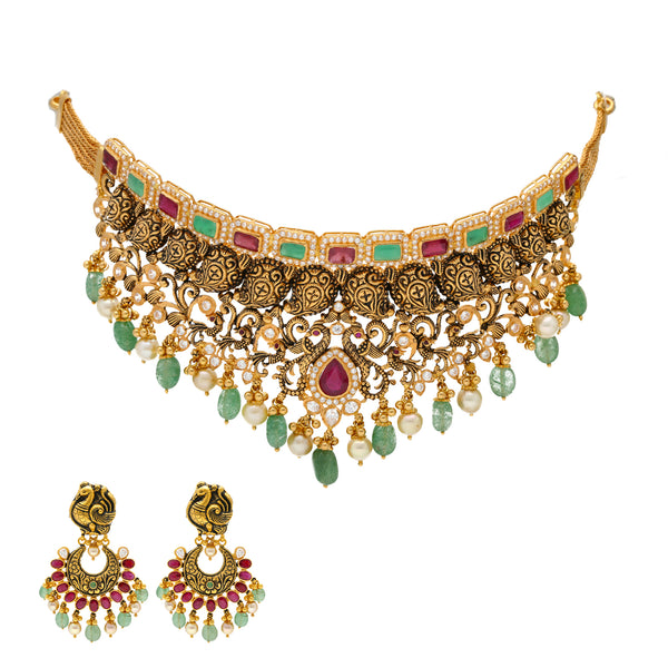 22K Antique Gold Choker Set with Gemstones & Pearls (98 grams) | 
This unique 22k gold jewelry set has a extravagantly engraved design with a shimmering assortmen...