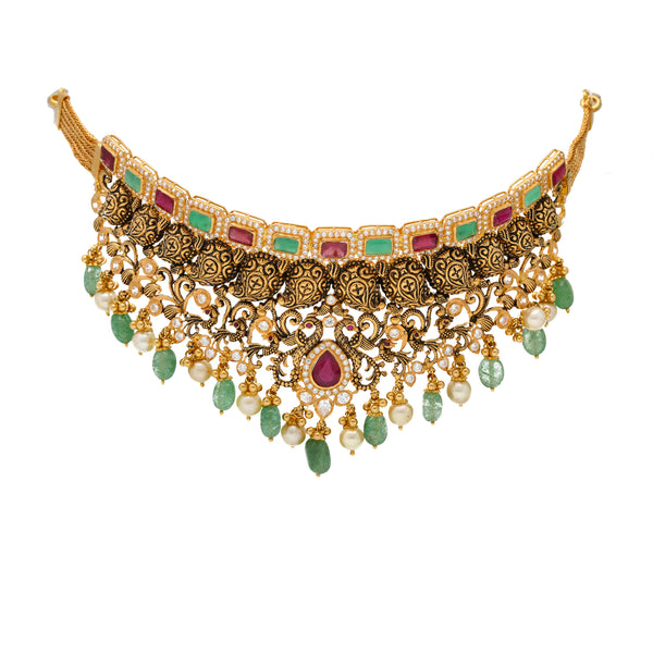 22K Antique Gold Choker Set with Gemstones & Pearls (98 grams) | 
This unique 22k gold jewelry set has a extravagantly engraved design with a shimmering assortmen...